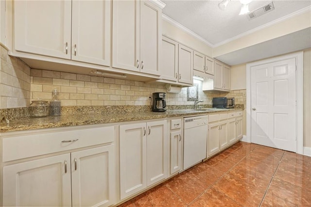 kitchen with visible vents, white dishwasher, black microwave, crown molding, and backsplash