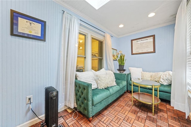 living area featuring recessed lighting, baseboards, and ornamental molding