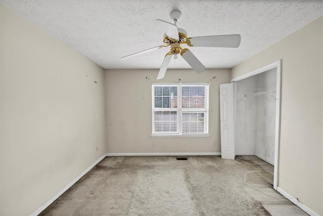 1735 Silver Way, Lithia Springs, GA 30122 - unfurnished bedroom featuring carpet flooring, a textured ceiling, a closet, and ceiling fan