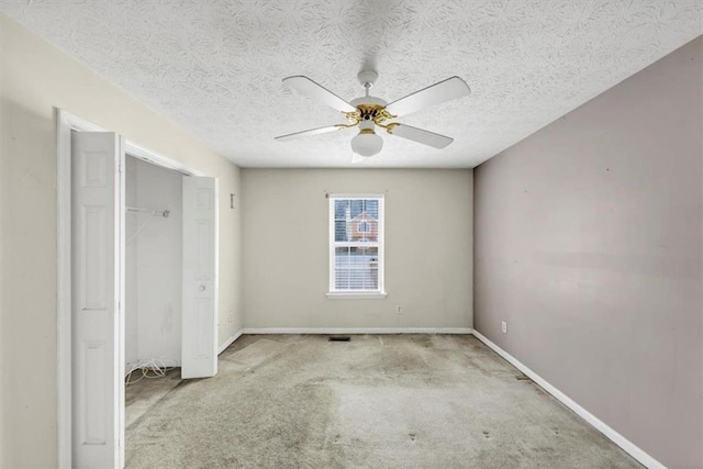 1735 Silver Way, Lithia Springs, GA 30122 - unfurnished bedroom with carpet, a ceiling fan, a textured ceiling, and a closet