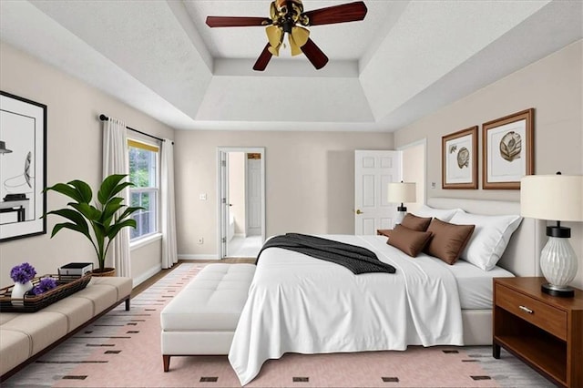 1735 Silver Way, Lithia Springs, GA 30122 - bedroom with a raised ceiling and a ceiling fan