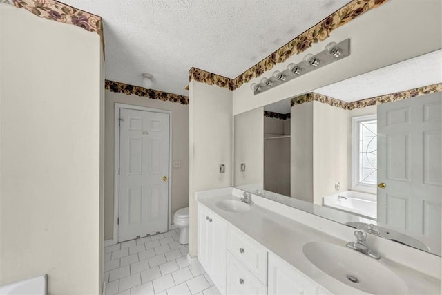 1735 Silver Way, Lithia Springs, GA 30122 - bathroom featuring a bath, double vanity, tile patterned floors, a textured ceiling, and a shower