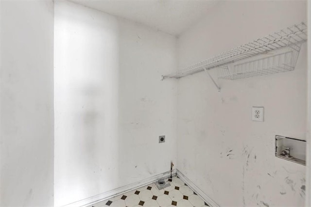 1735 Silver Way, Lithia Springs, GA 30122 - laundry area featuring hookup for an electric dryer, tile patterned floors, and hookup for a washing machine