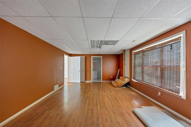1735 Silver Way, Lithia Springs, GA 30122 - empty room featuring a drop ceiling and wood finished floors