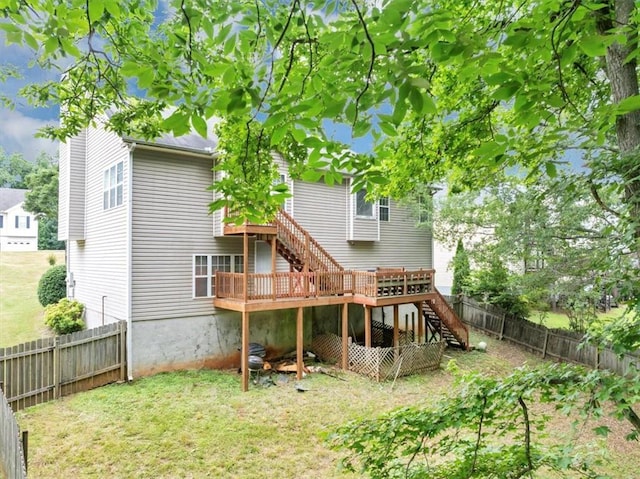 1735 Silver Way, Lithia Springs, GA 30122 - rear view of property with stairway, a fenced backyard, and a deck