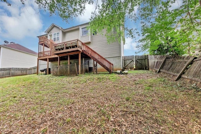 1735 Silver Way, Lithia Springs, GA 30122 - rear view of house featuring a fenced backyard, stairway, and a wooden deck