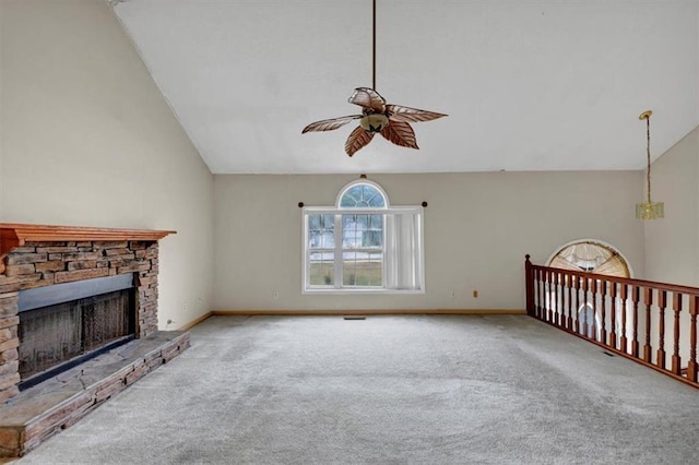 1735 Silver Way, Lithia Springs, GA 30122 - unfurnished living room featuring lofted ceiling, ceiling fan, a fireplace, and carpet