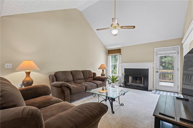 185 Fox Run, Loganville, GA 30052 - carpeted living area with high vaulted ceiling, a ceiling fan, and a fireplace with flush hearth