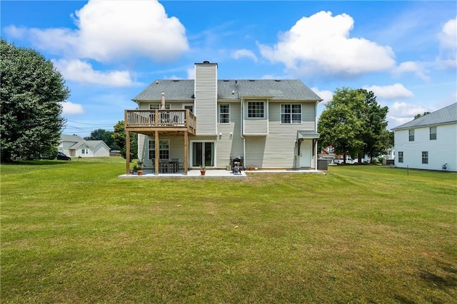 185 Fox Run, Loganville, GA 30052 - rear view of property featuring a patio area, a yard, a chimney, and a deck