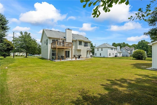 185 Fox Run, Loganville, GA 30052 - back of house with a patio, a lawn, a deck, and a chimney