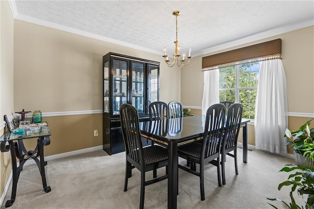 185 Fox Run, Loganville, GA 30052 - dining space featuring a chandelier, a textured ceiling, crown molding, and light colored carpet