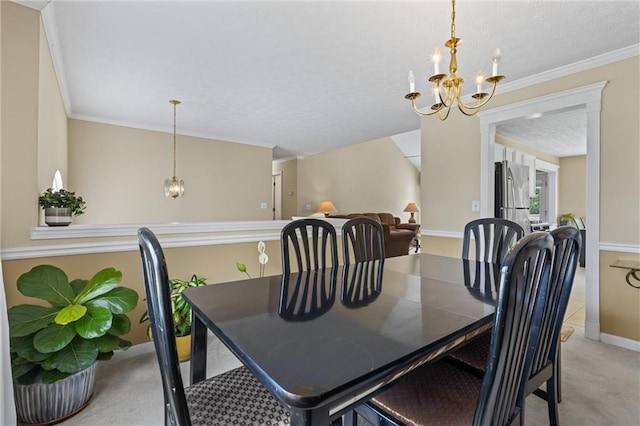 185 Fox Run, Loganville, GA 30052 - dining room featuring a chandelier, light colored carpet, a textured ceiling, and crown molding