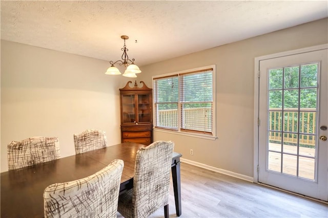 1638 River Trce, Auburn, GA 30011 - dining room with light wood-type flooring, baseboards, and a chandelier