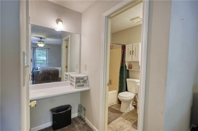 1638 River Trce, Auburn, GA 30011 - ensuite bathroom featuring toilet, shower / bath combination with curtain, ceiling fan, and baseboards