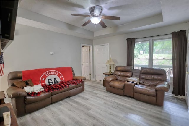 1638 River Trce, Auburn, GA 30011 - living room with a raised ceiling, light wood-style flooring, and a ceiling fan