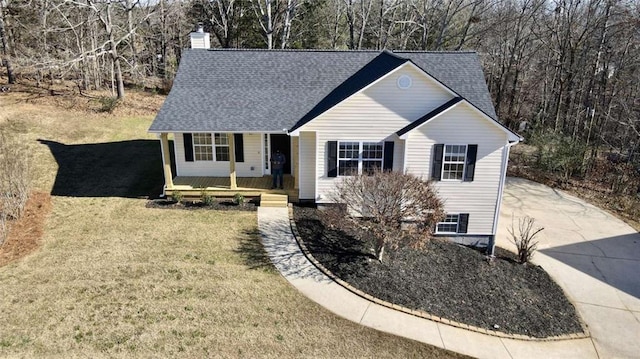 view of front of property with a porch and a front yard