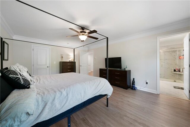 bedroom with ornamental molding, hardwood / wood-style floors, connected bathroom, and ceiling fan