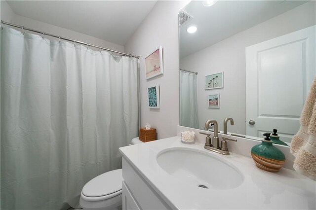 bathroom with vanity and toilet