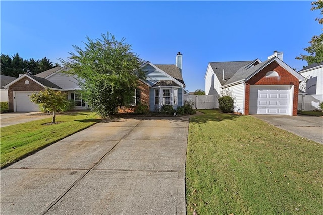 view of front of property featuring a front yard and a garage