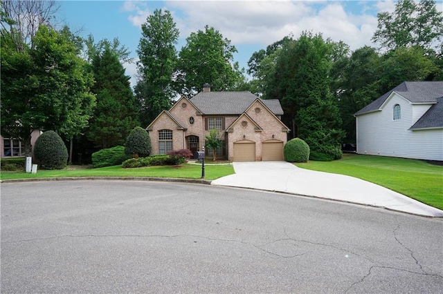 7185 Hartsfield Pl, Suwanee, GA 30024 - view of front of property with driveway, a garage, a chimney, and a front yard