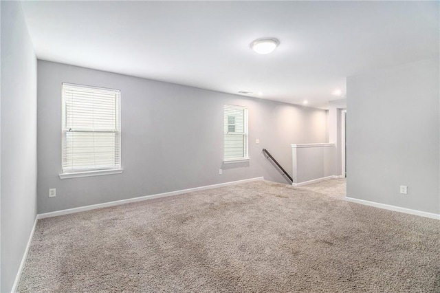 spare room with carpet flooring and baseboards
