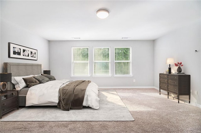 carpeted bedroom with baseboards