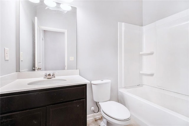 bathroom with toilet, vanity, shower / bathtub combination, and baseboards