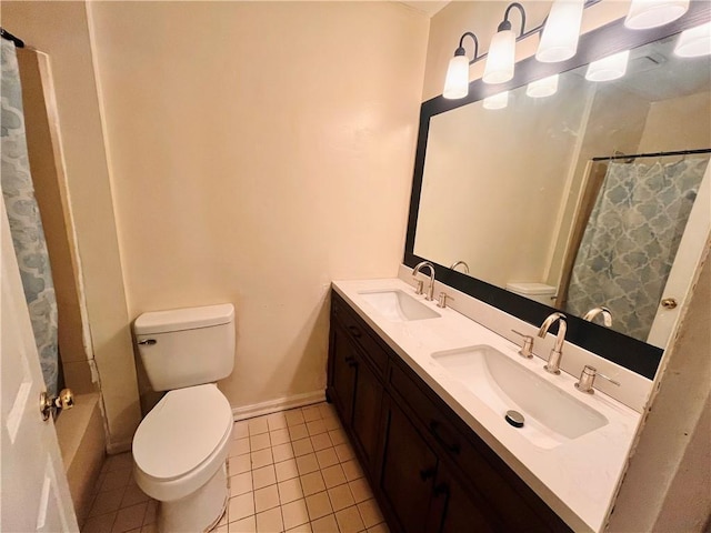 bathroom featuring vanity, curtained shower, tile patterned floors, and toilet