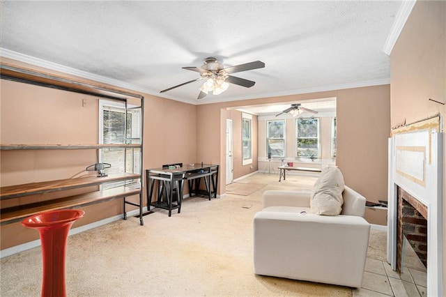 living area featuring baseboards, ornamental molding, carpet, a textured ceiling, and a fireplace