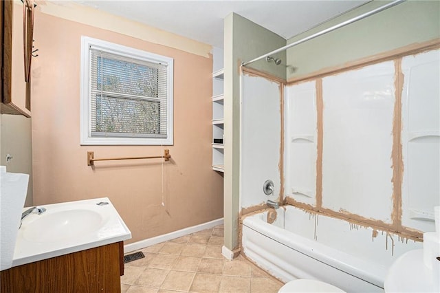 bathroom featuring baseboards, toilet, tile patterned floors, vanity, and shower / bathing tub combination