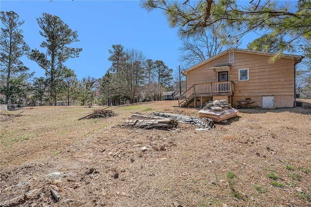 rear view of property with crawl space