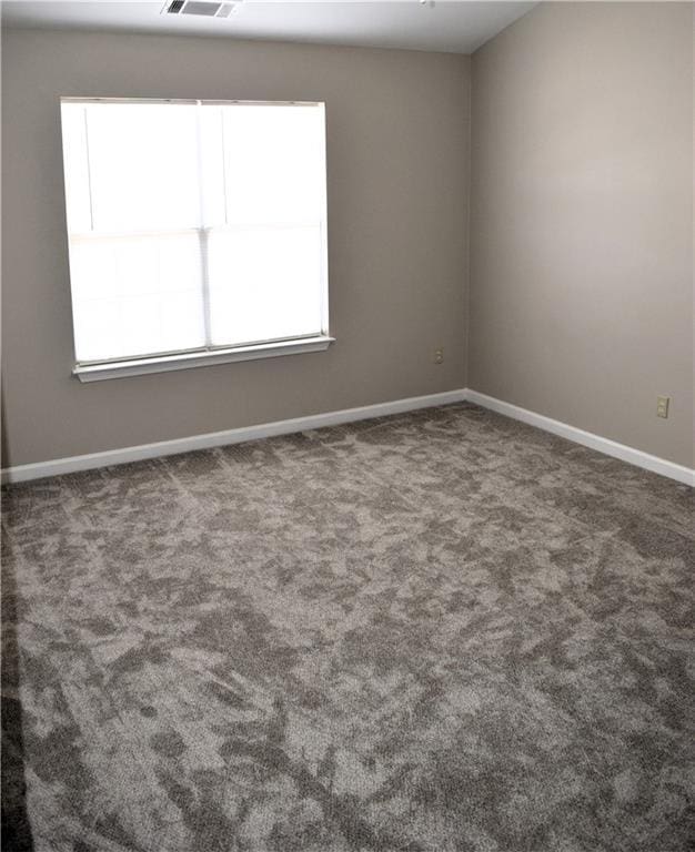 235 Woodland Way, Canton, GA 30114 - unfurnished room with visible vents, baseboards, and carpet floors