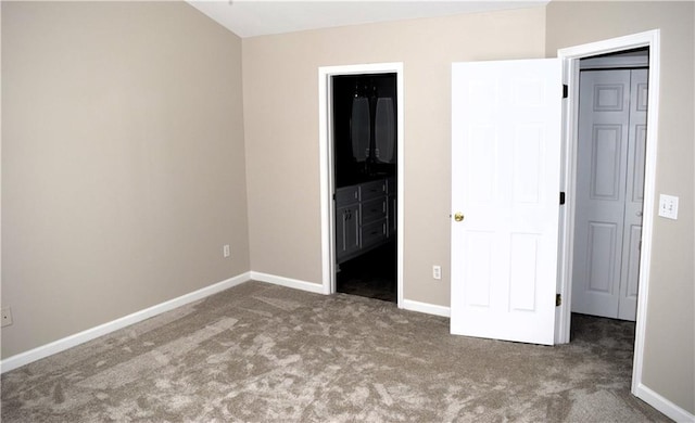235 Woodland Way, Canton, GA 30114 - unfurnished bedroom featuring carpet flooring, ensuite bathroom, and baseboards