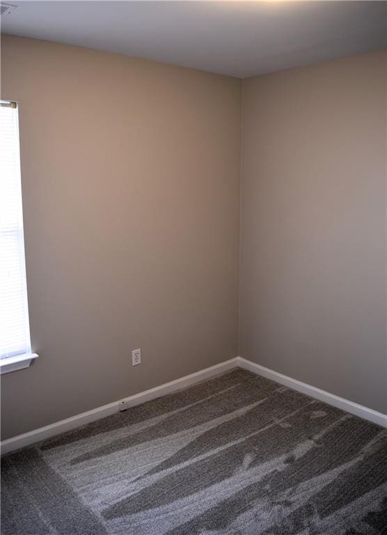 235 Woodland Way, Canton, GA 30114 - carpeted empty room with baseboards