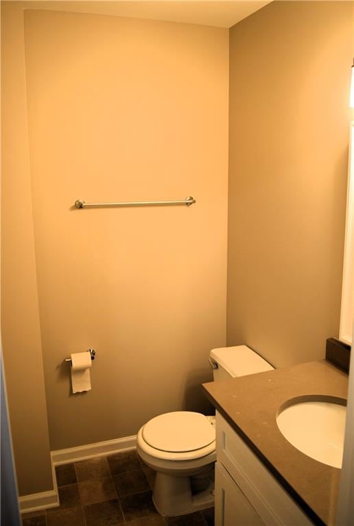 235 Woodland Way, Canton, GA 30114 - bathroom featuring baseboards, toilet, and vanity