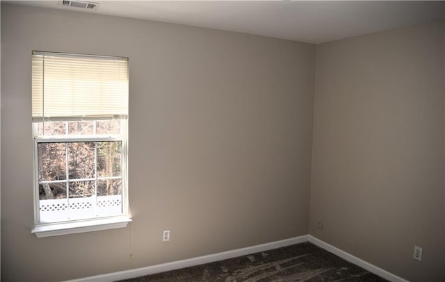 235 Woodland Way, Canton, GA 30114 - unfurnished room featuring visible vents, baseboards, and dark carpet