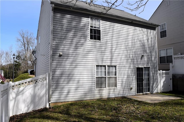 235 Woodland Way, Canton, GA 30114 - back of property with a patio area, a lawn, and fence