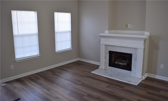 235 Woodland Way, Canton, GA 30114 - unfurnished living room with baseboards, dark wood-style flooring, and a high end fireplace