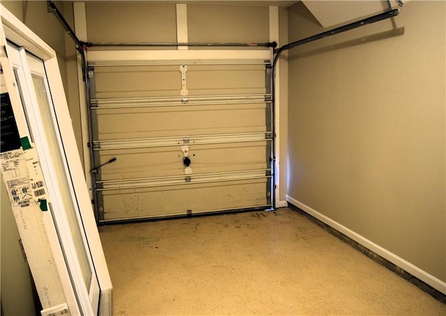 235 Woodland Way, Canton, GA 30114 - garage featuring baseboards