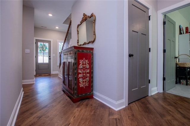 corridor featuring dark hardwood / wood-style flooring