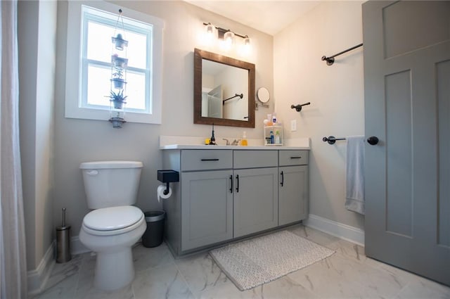 bathroom with vanity and toilet