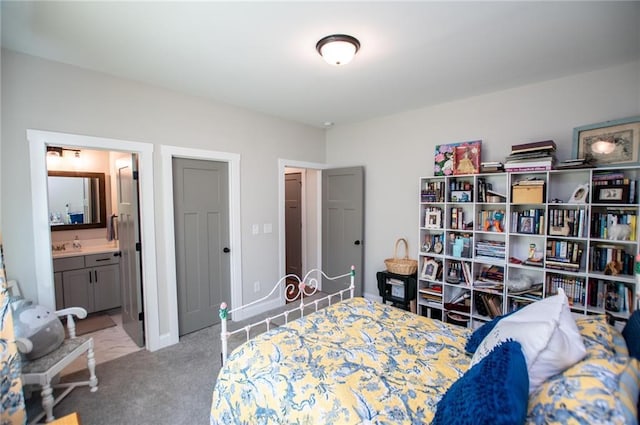 carpeted bedroom with ensuite bath