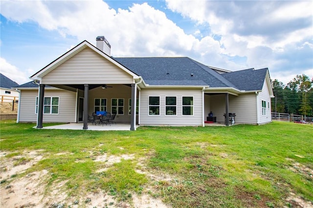 back of house with a yard, ceiling fan, and a patio area