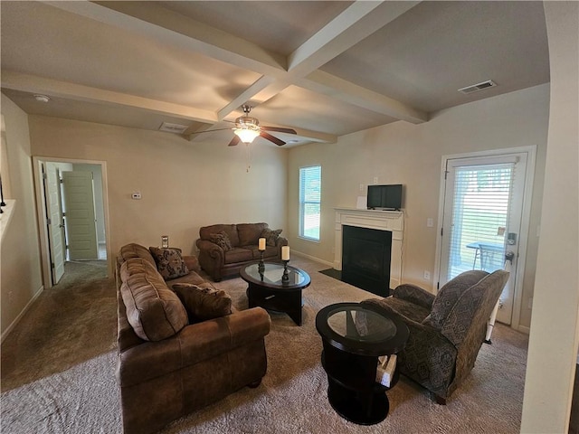 carpeted living room featuring beam ceiling, a fireplace with flush hearth, a ceiling fan, baseboards, and coffered ceiling