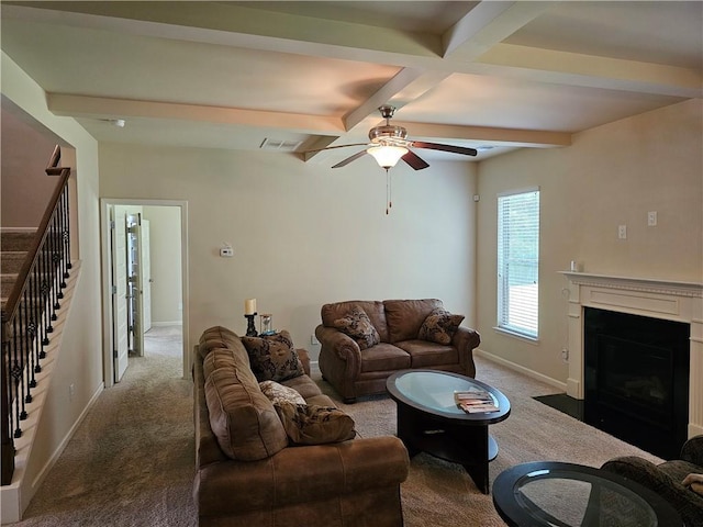 1750 Stone Meadow Rd, Lithonia, GA 30058 - carpeted living room with beamed ceiling, stairs, ceiling fan, and a fireplace with flush hearth