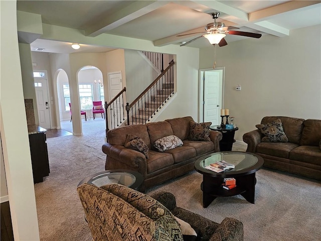 1750 Stone Meadow Rd, Lithonia, GA 30058 - living area with carpet, arched walkways, beam ceiling, ceiling fan, and stairs