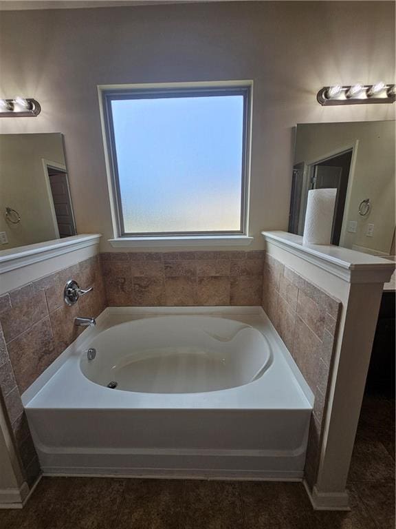 bathroom featuring a bath and tile patterned flooring