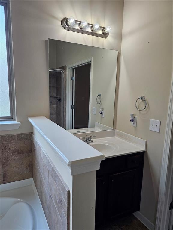 1750 Stone Meadow Rd, Lithonia, GA 30058 - bathroom with a garden tub, vanity, and a tile shower