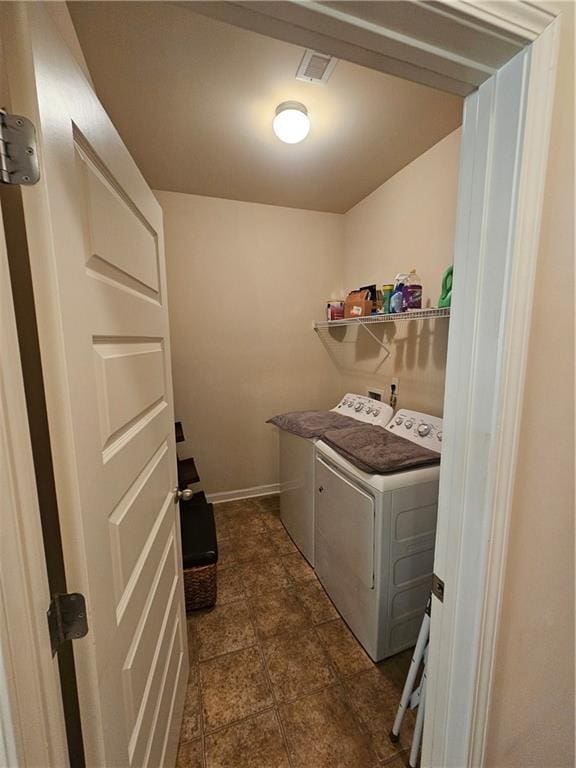 washroom featuring washer and dryer