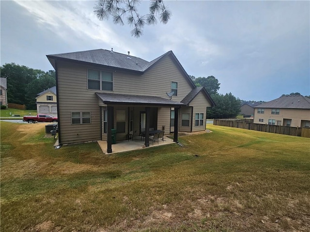 rear view of property featuring a patio